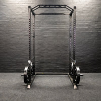 Thumbnail for A weight lifting rack presented in a home gym setting