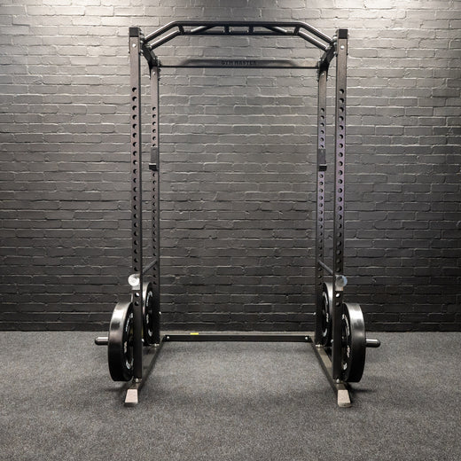 A weight lifting rack presented in a home gym setting